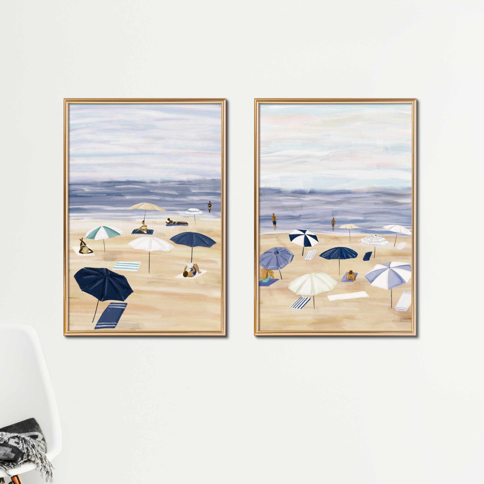 two paintings of beach umbrellas on a white wall