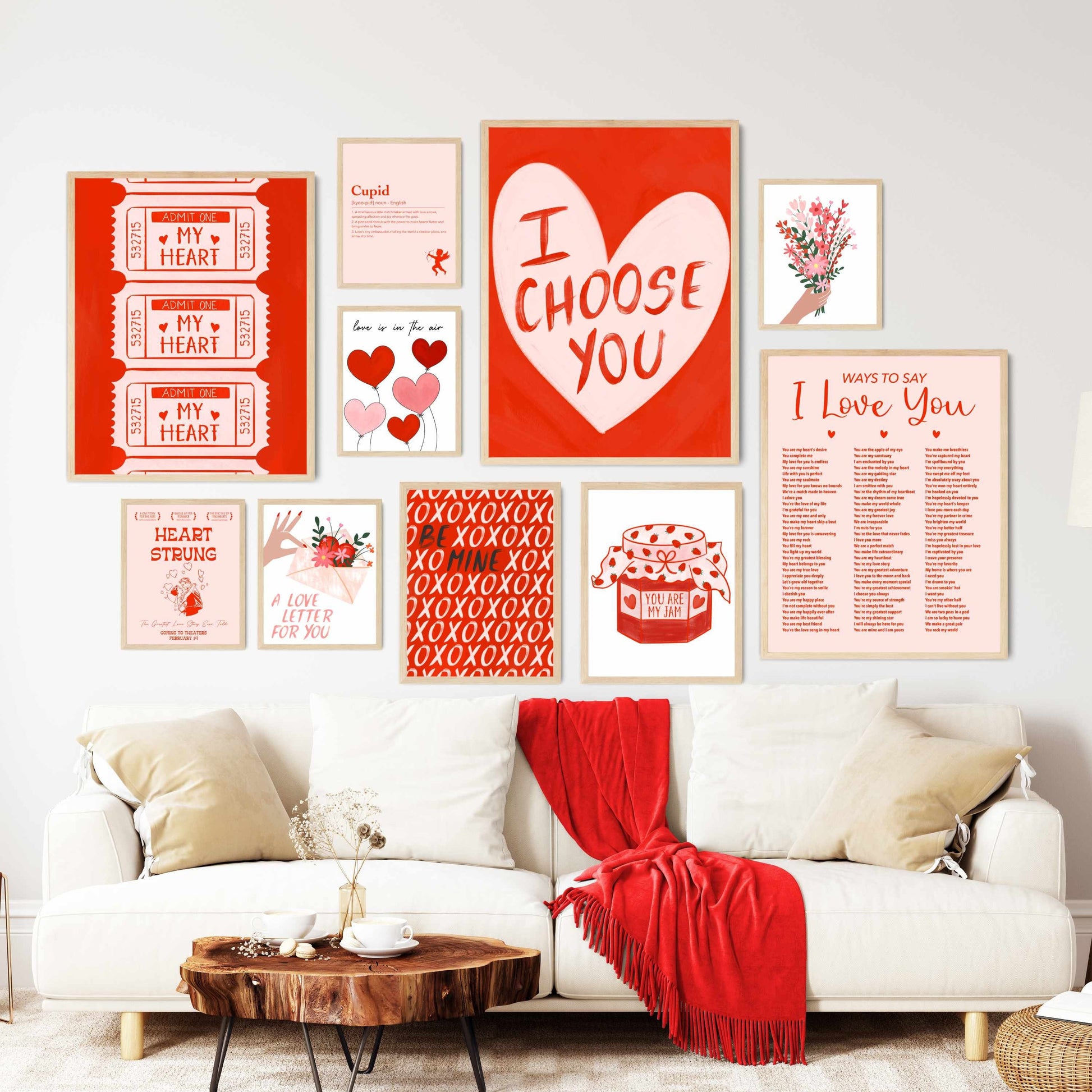 a living room with a white couch and lots of pictures on the wall