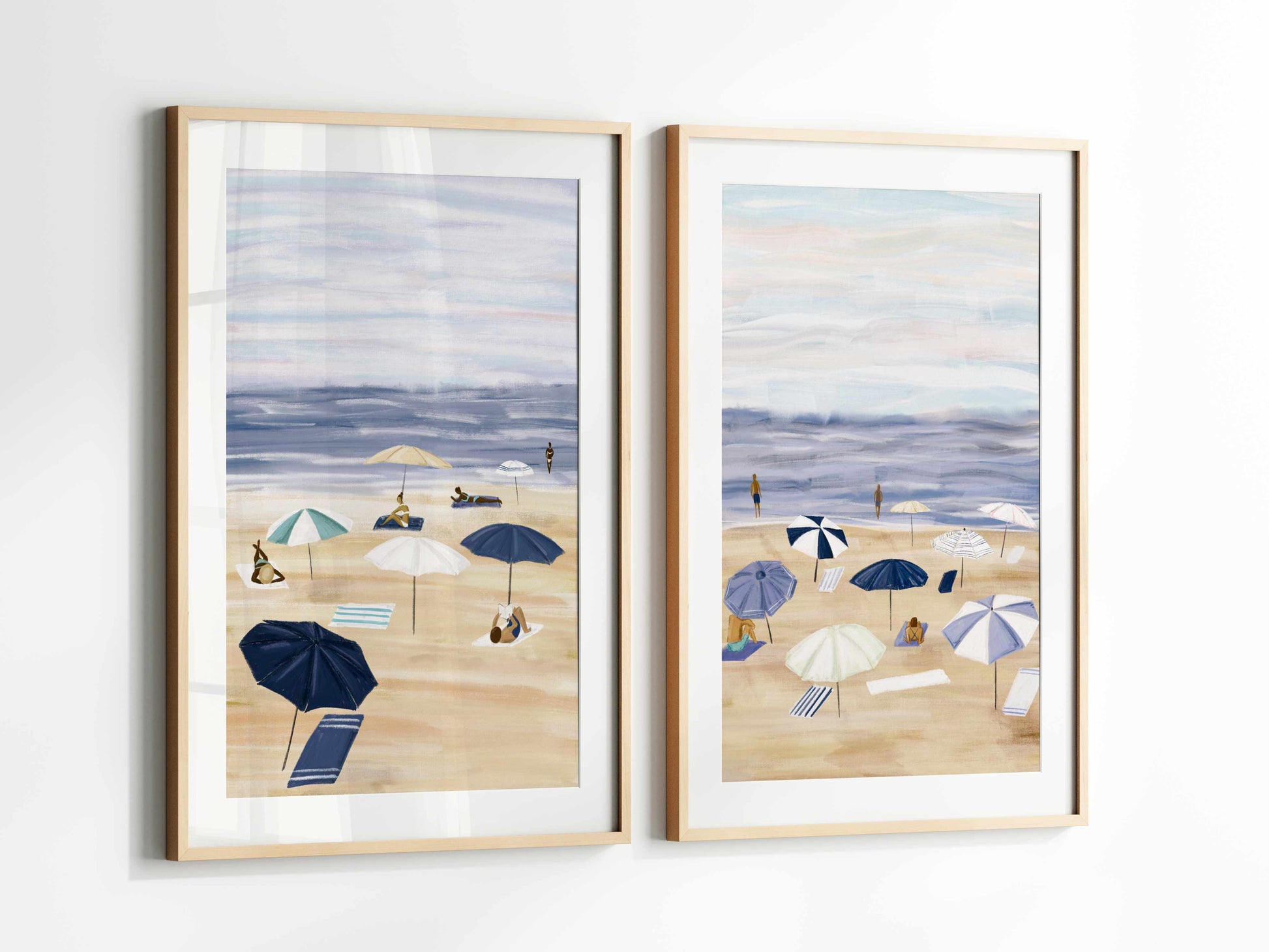 two paintings of beach umbrellas on a white wall
